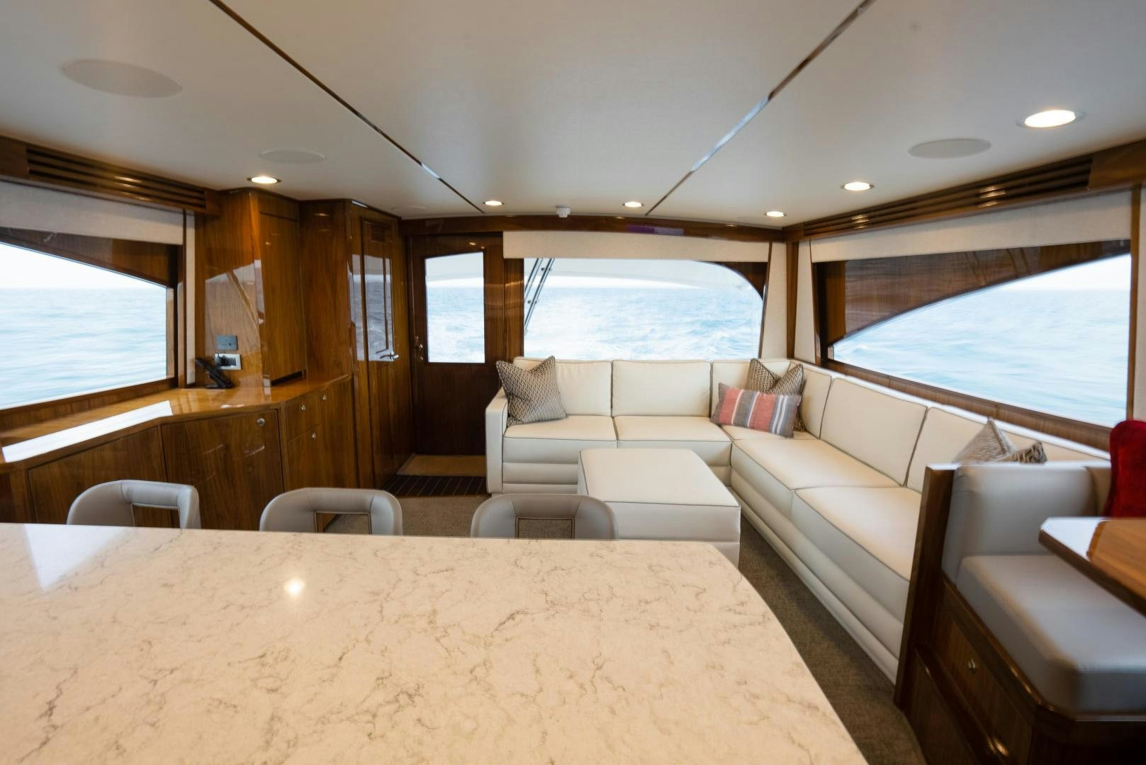 a living room with a large window aboard DAWG DAZE Yacht for Sale