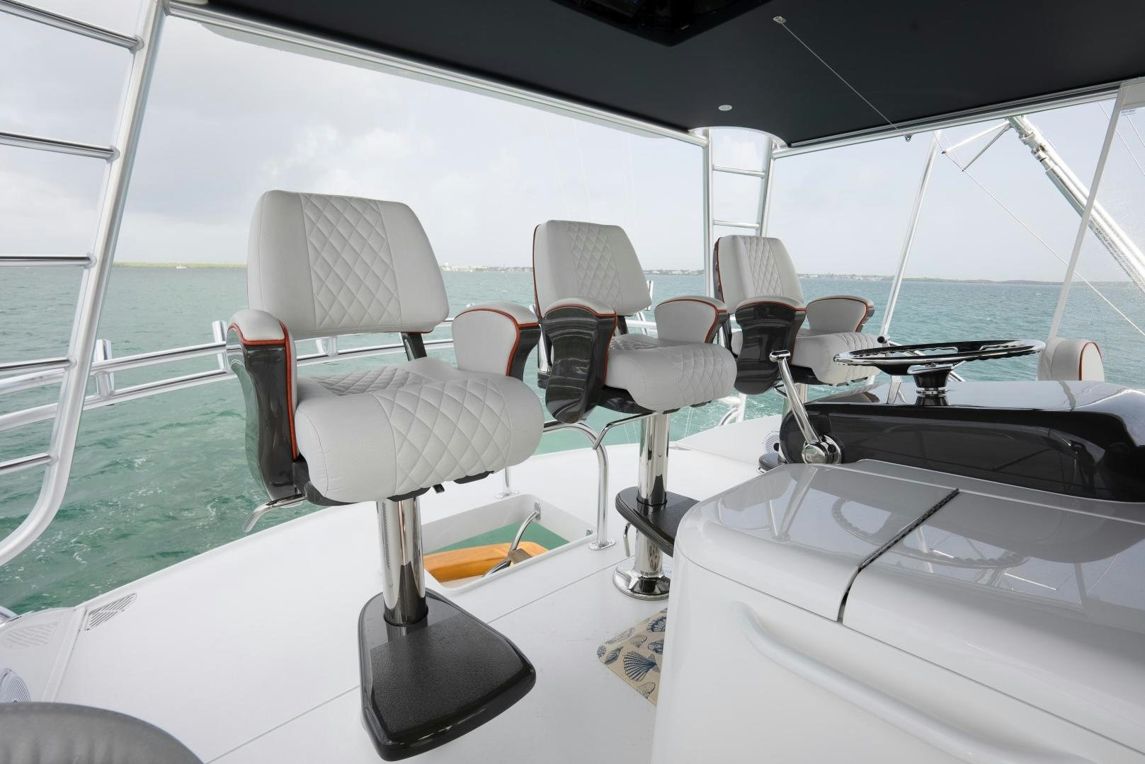 a boat with chairs and tables aboard DAWG DAZE Yacht for Sale