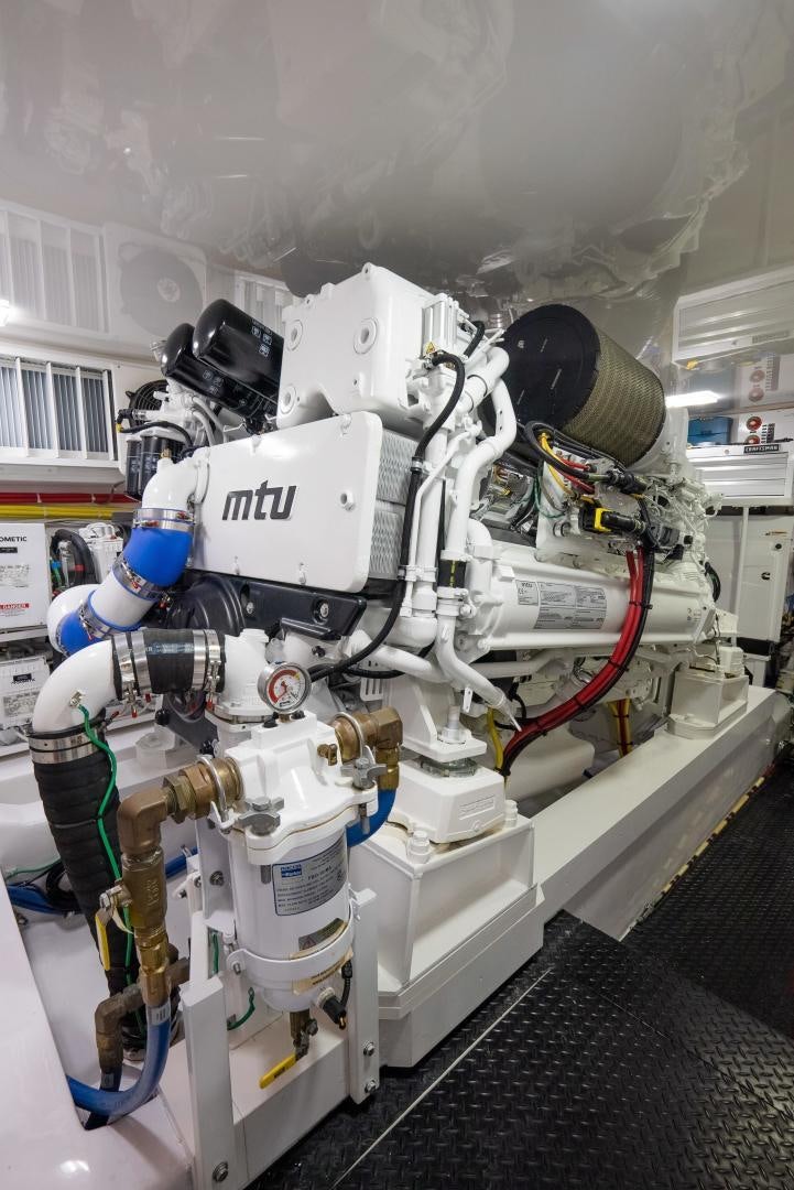 a white robot with red and blue eyes aboard DAWG DAZE Yacht for Sale