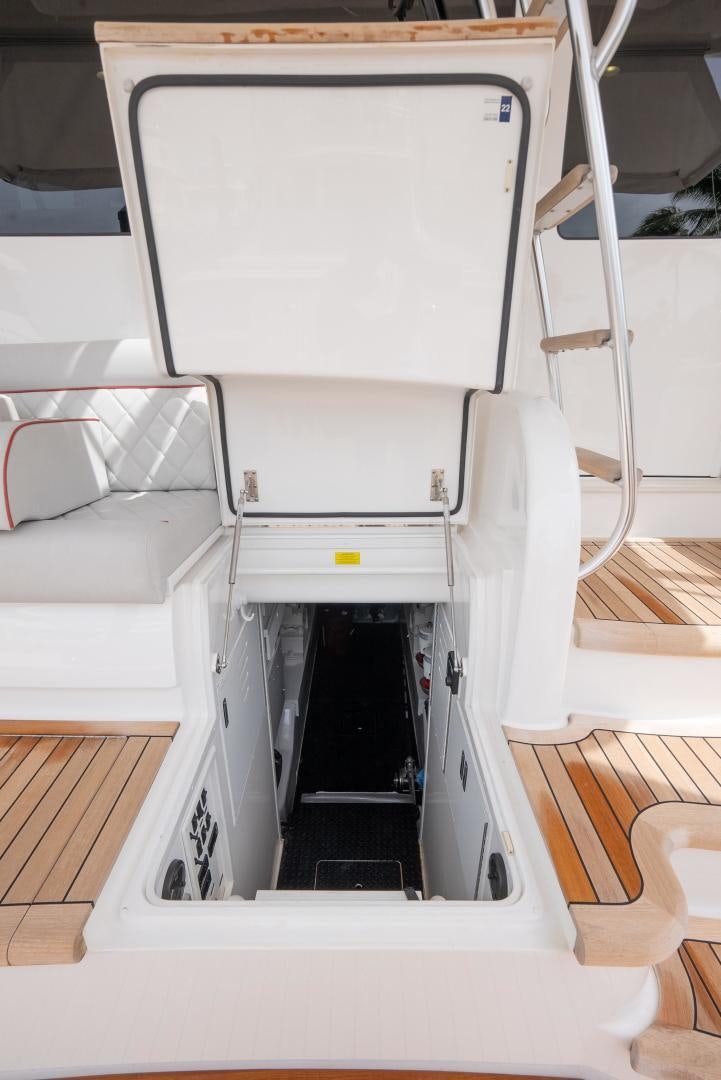 a white machine with a black door aboard DAWG DAZE Yacht for Sale