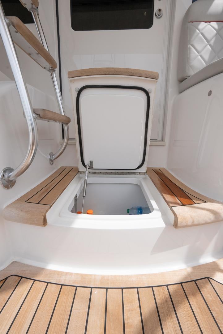 a toilet with a seat open aboard DAWG DAZE Yacht for Sale