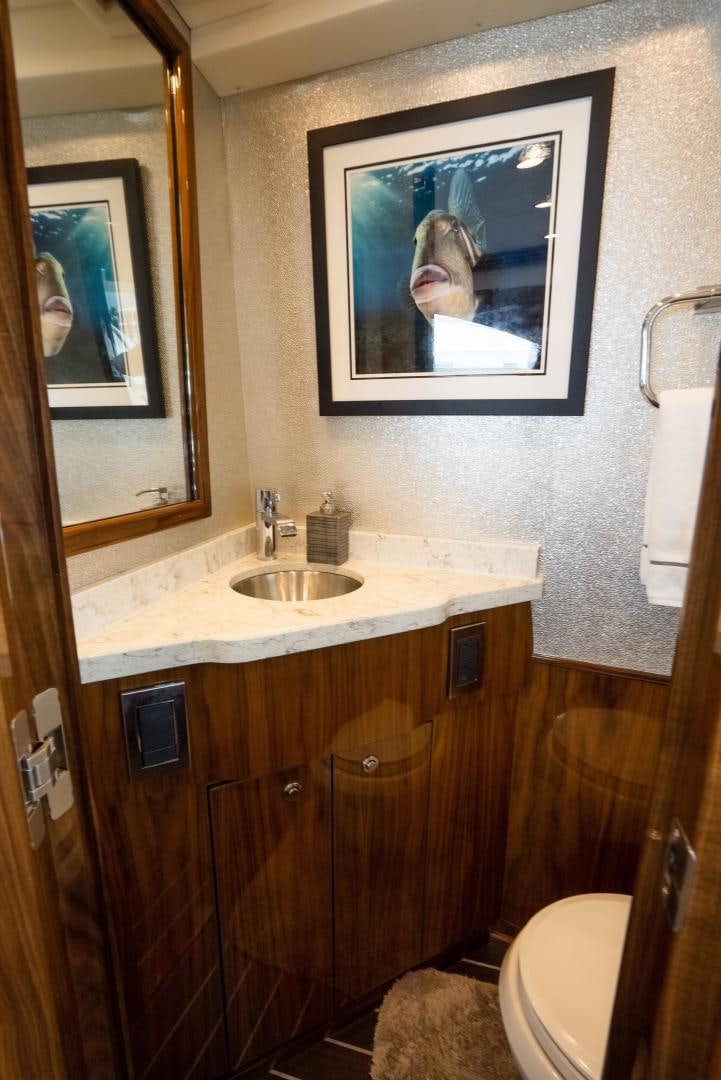 a bathroom with a sink and a toilet aboard DAWG DAZE Yacht for Sale