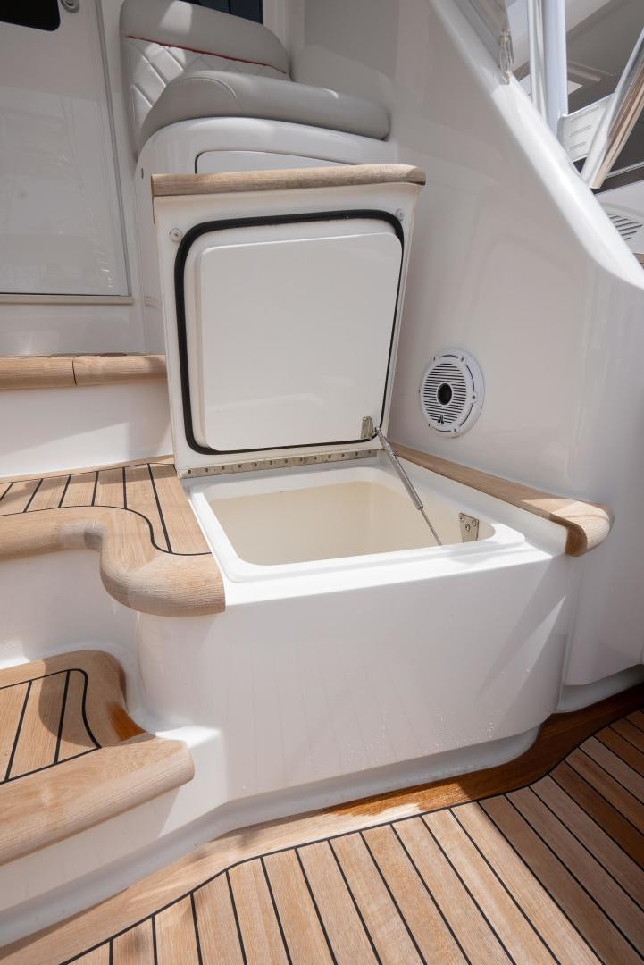 a toilet with a wooden seat aboard DAWG DAZE Yacht for Sale