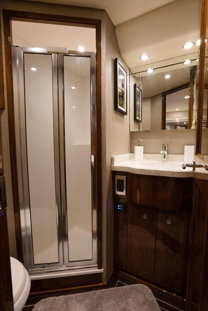 a bathroom with a standup shower aboard DAWG DAZE Yacht for Sale
