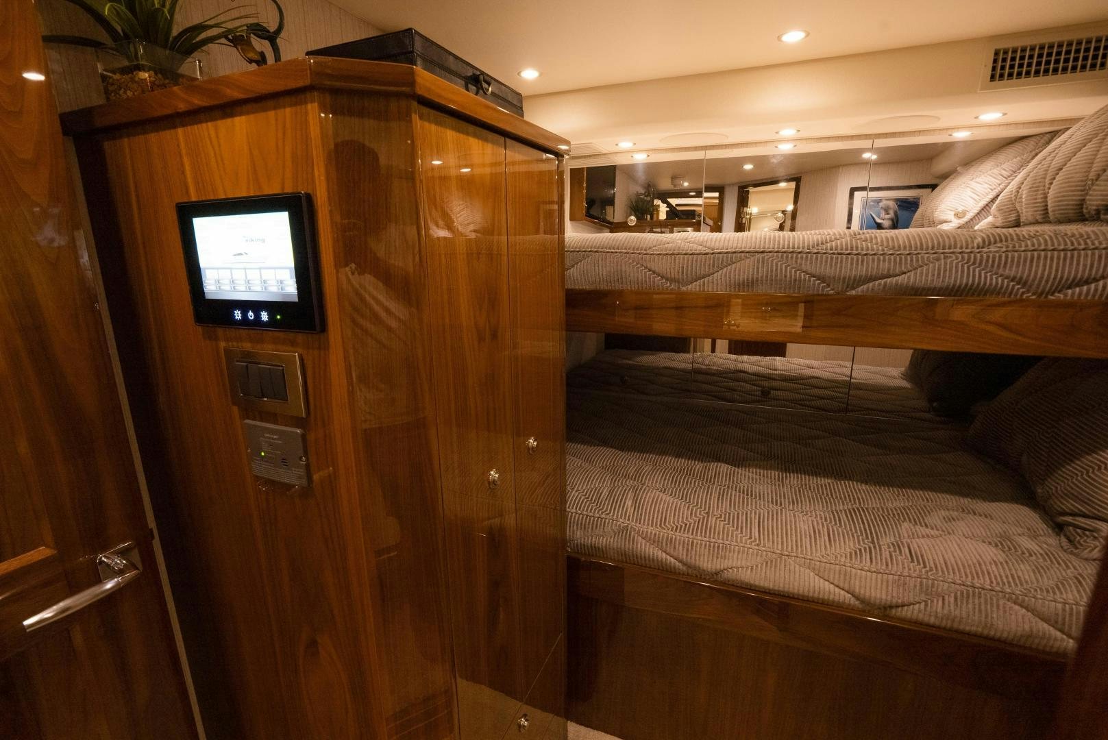 a room with a tv and a bed aboard DAWG DAZE Yacht for Sale