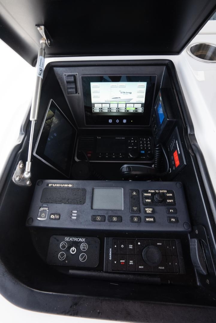 a black car with a digital display aboard DAWG DAZE Yacht for Sale