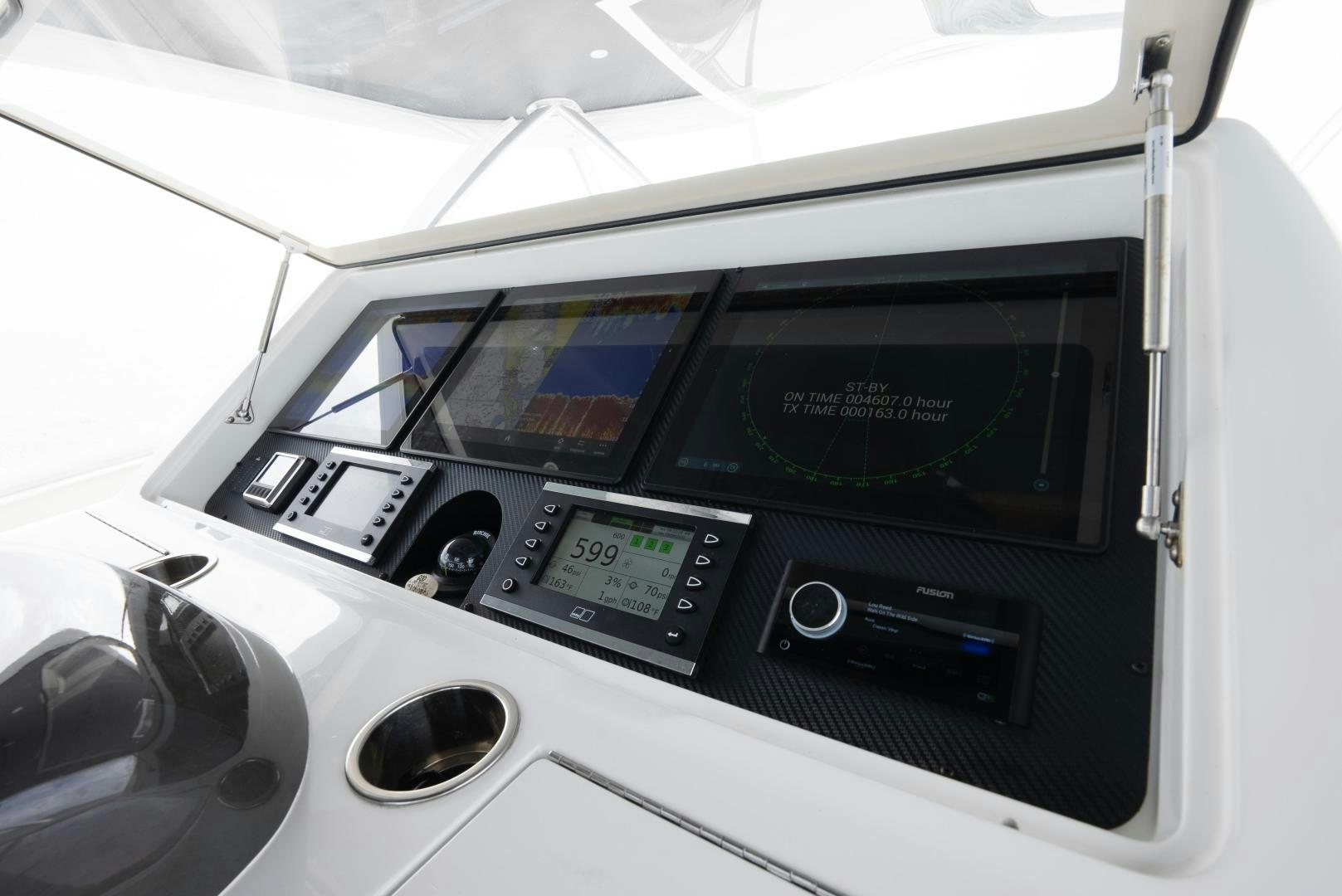 a white machine with a screen aboard DAWG DAZE Yacht for Sale