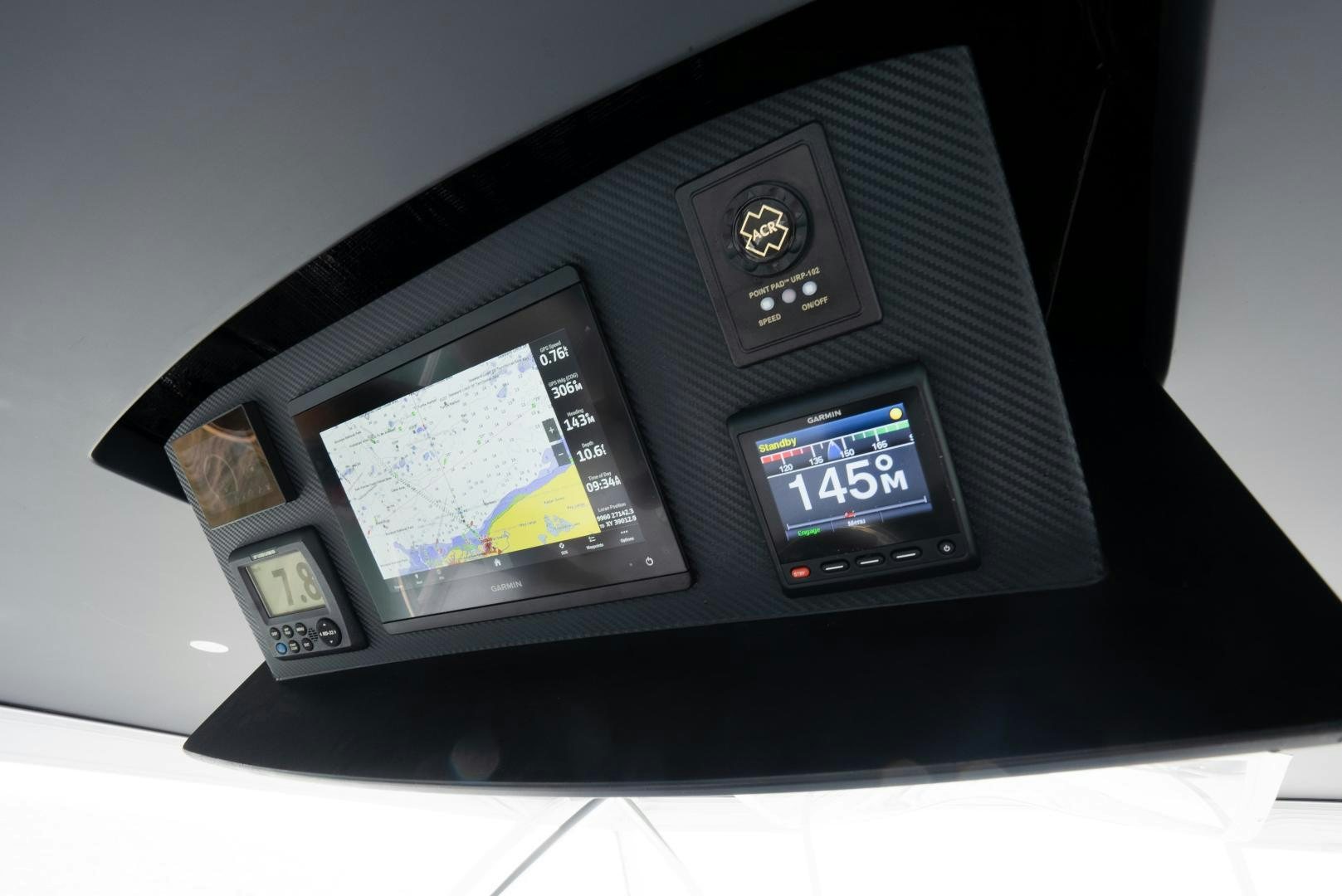 a black electronic device aboard DAWG DAZE Yacht for Sale