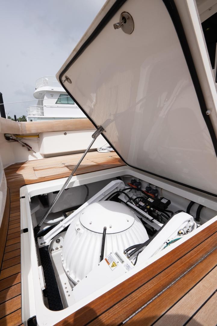a white record player aboard DAWG DAZE Yacht for Sale