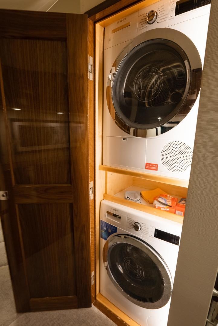 a washer and dryer in a room aboard DAWG DAZE Yacht for Sale