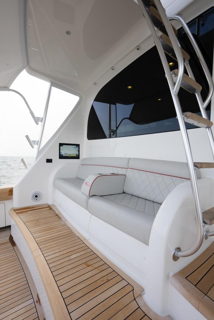 a white couch in a room aboard DAWG DAZE Yacht for Sale