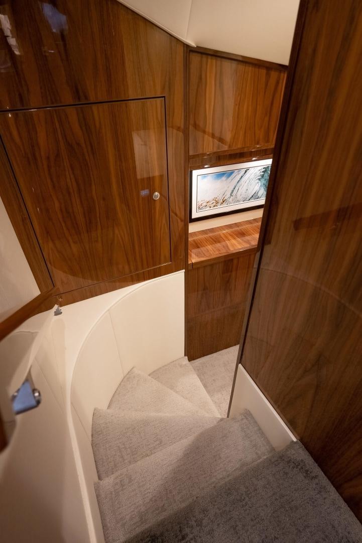 a room with a tv and a bed aboard DAWG DAZE Yacht for Sale