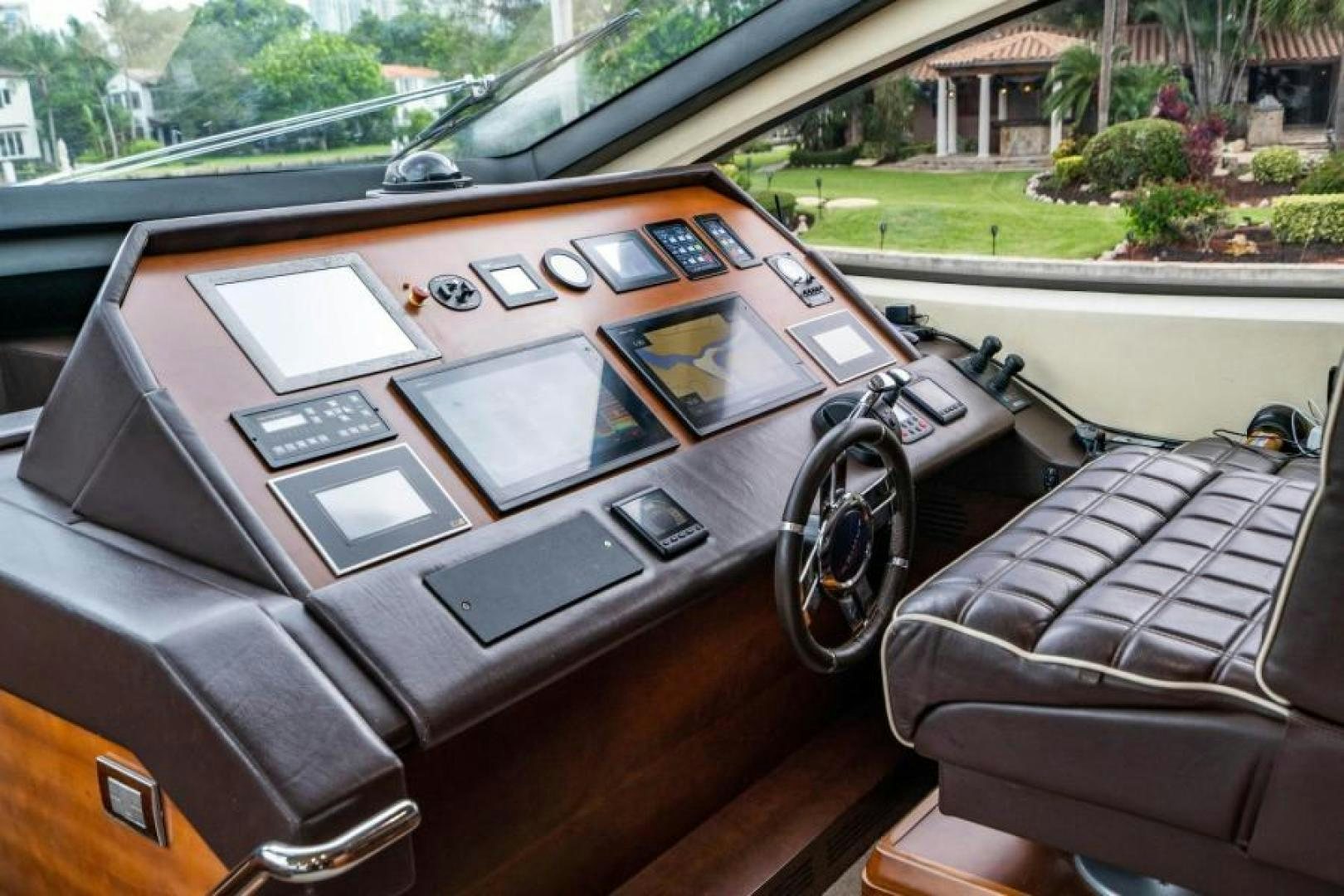a car with a screen and steering wheel aboard KNOT WOKE Yacht for Sale