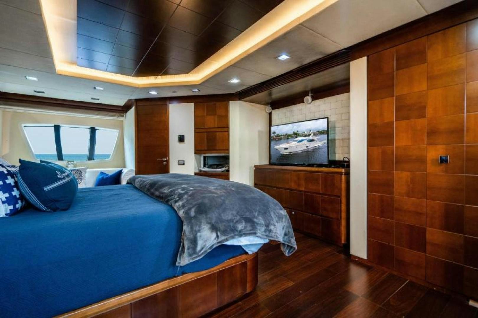 a bedroom with wood walls aboard KNOT WOKE Yacht for Sale