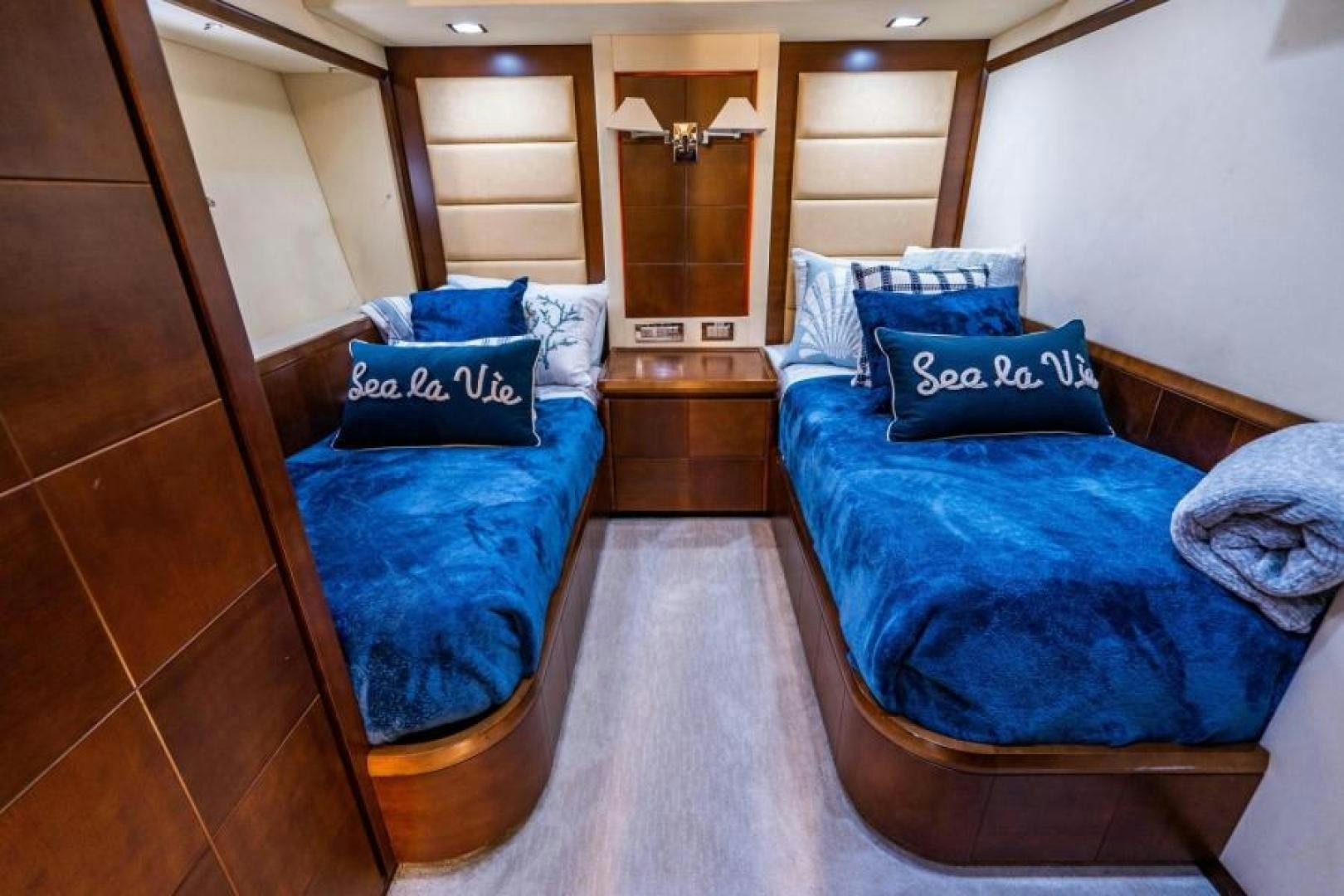 a room with a bed and a mirror aboard KNOT WOKE Yacht for Sale