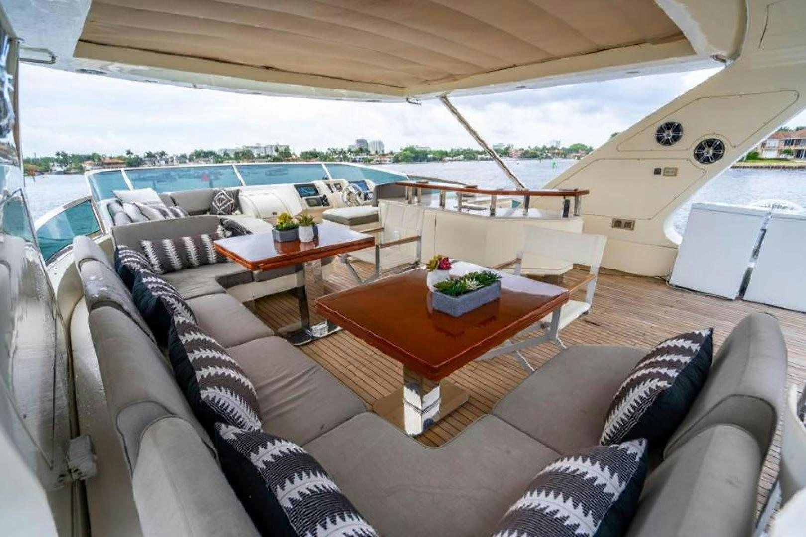a living room with a large patio aboard KNOT WOKE Yacht for Sale
