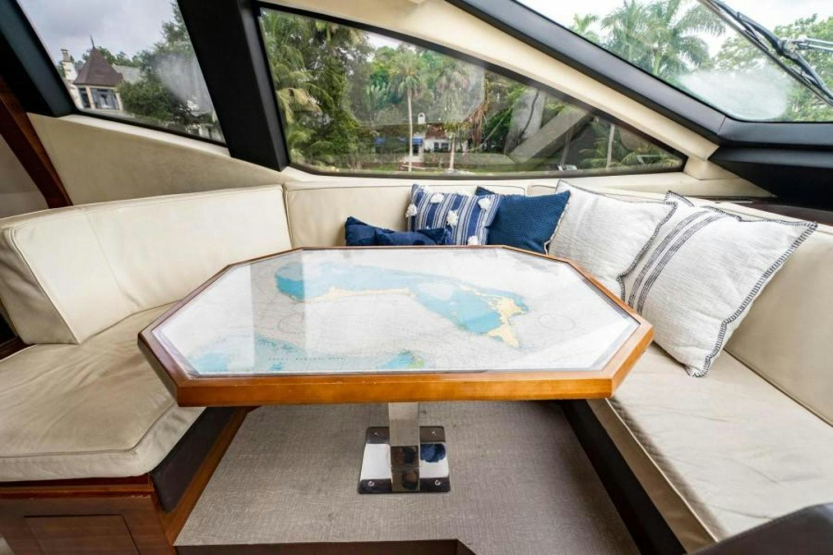 a couch with a table in the back aboard KNOT WOKE Yacht for Sale