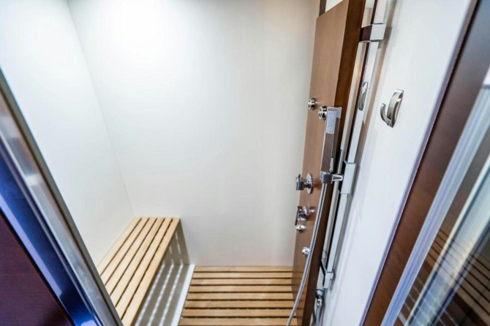 a wooden staircase with a door aboard KNOT WOKE Yacht for Sale