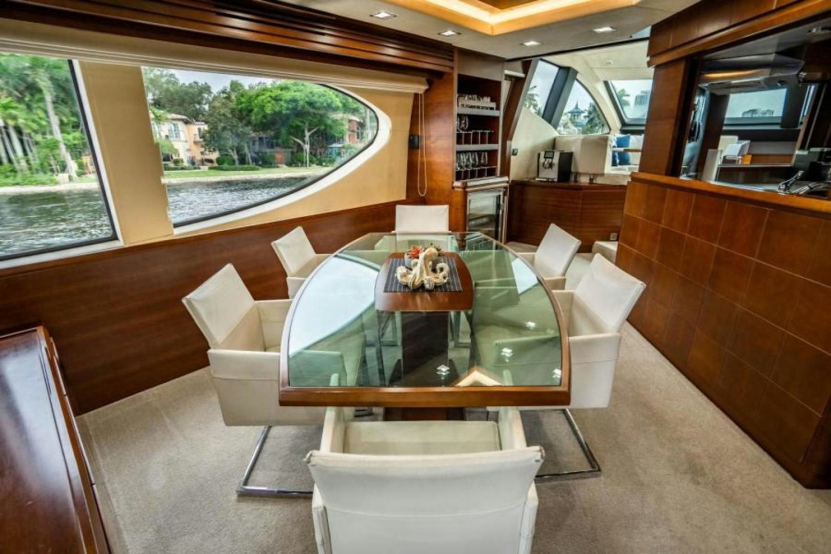 a table and chairs in a train aboard KNOT WOKE Yacht for Sale