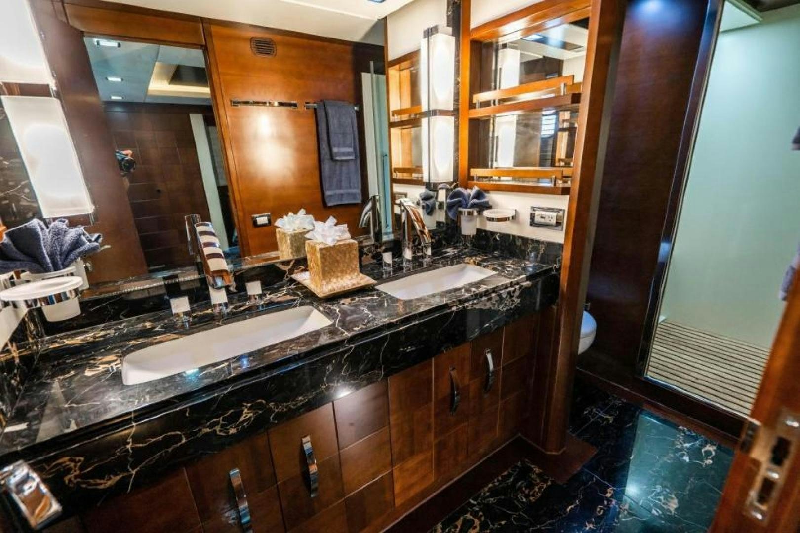a bathroom with sinks and mirrors aboard KNOT WOKE Yacht for Sale