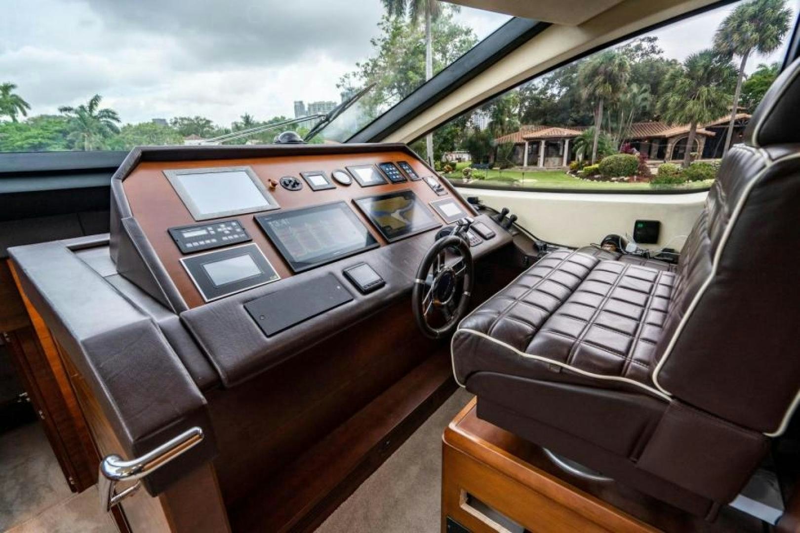 a car with a screen and a steering wheel aboard KNOT WOKE Yacht for Sale