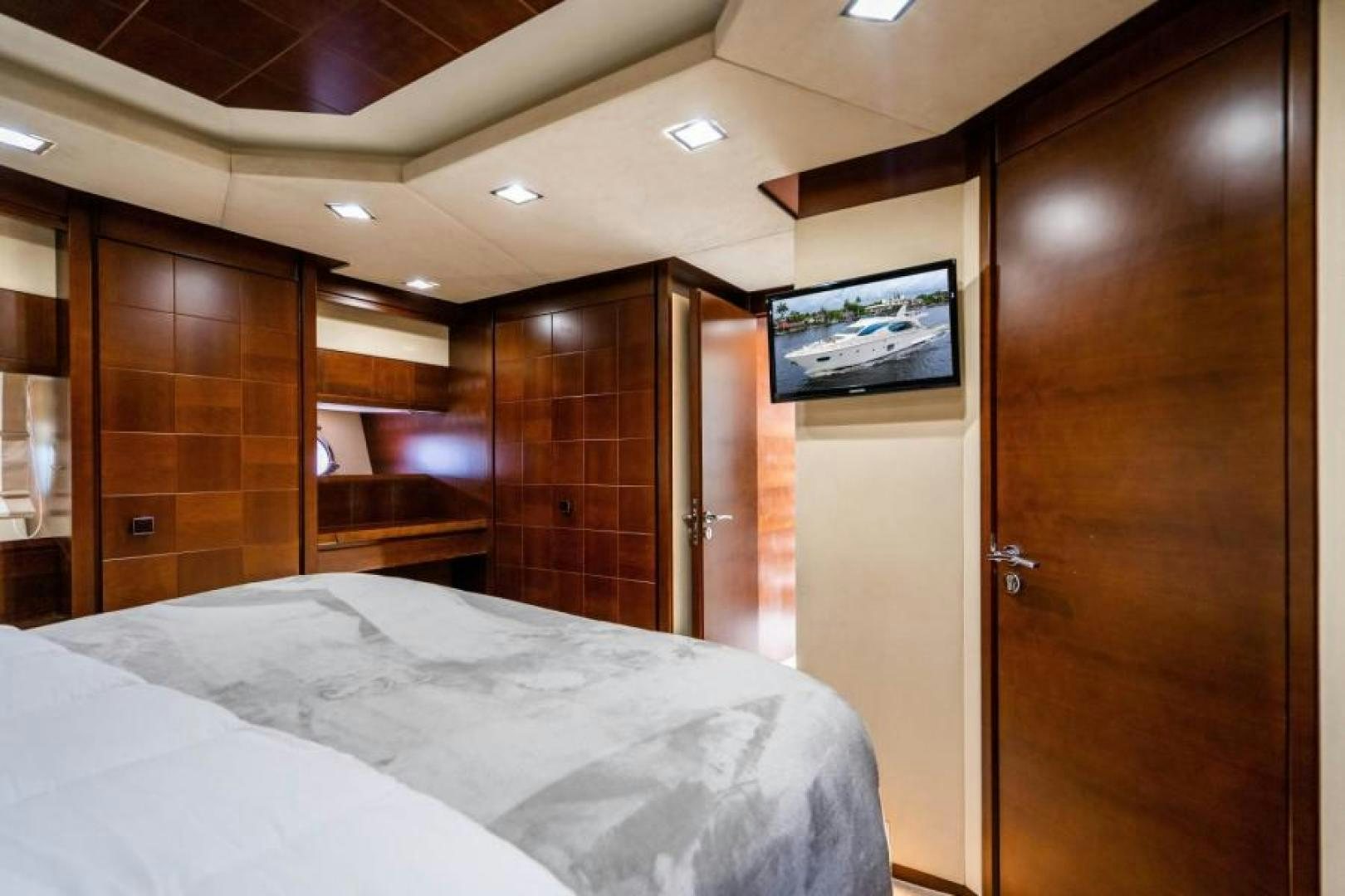 a room with a bed and a television aboard KNOT WOKE Yacht for Sale
