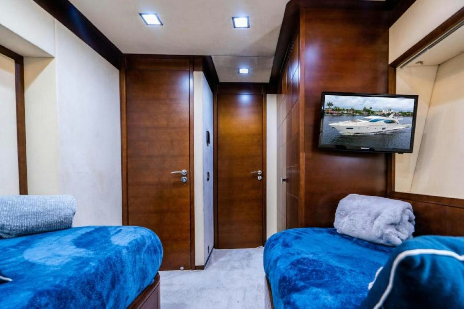 a room with a bed and a television aboard KNOT WOKE Yacht for Sale