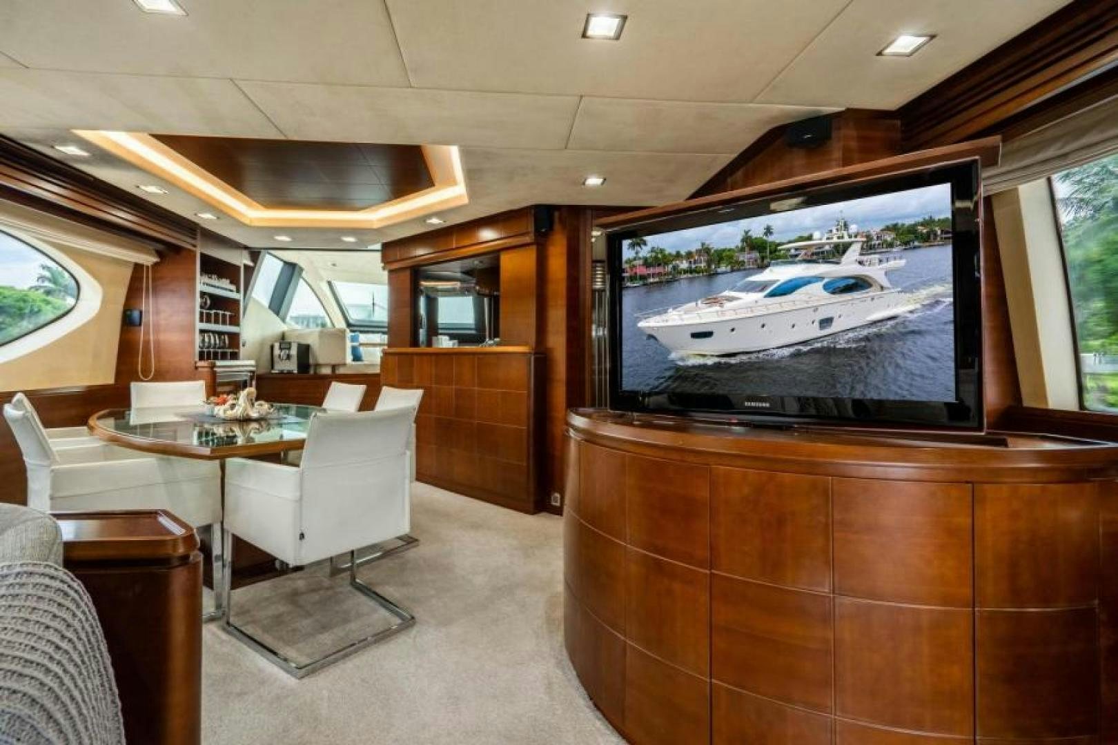 a room with a tv and chairs aboard KNOT WOKE Yacht for Sale