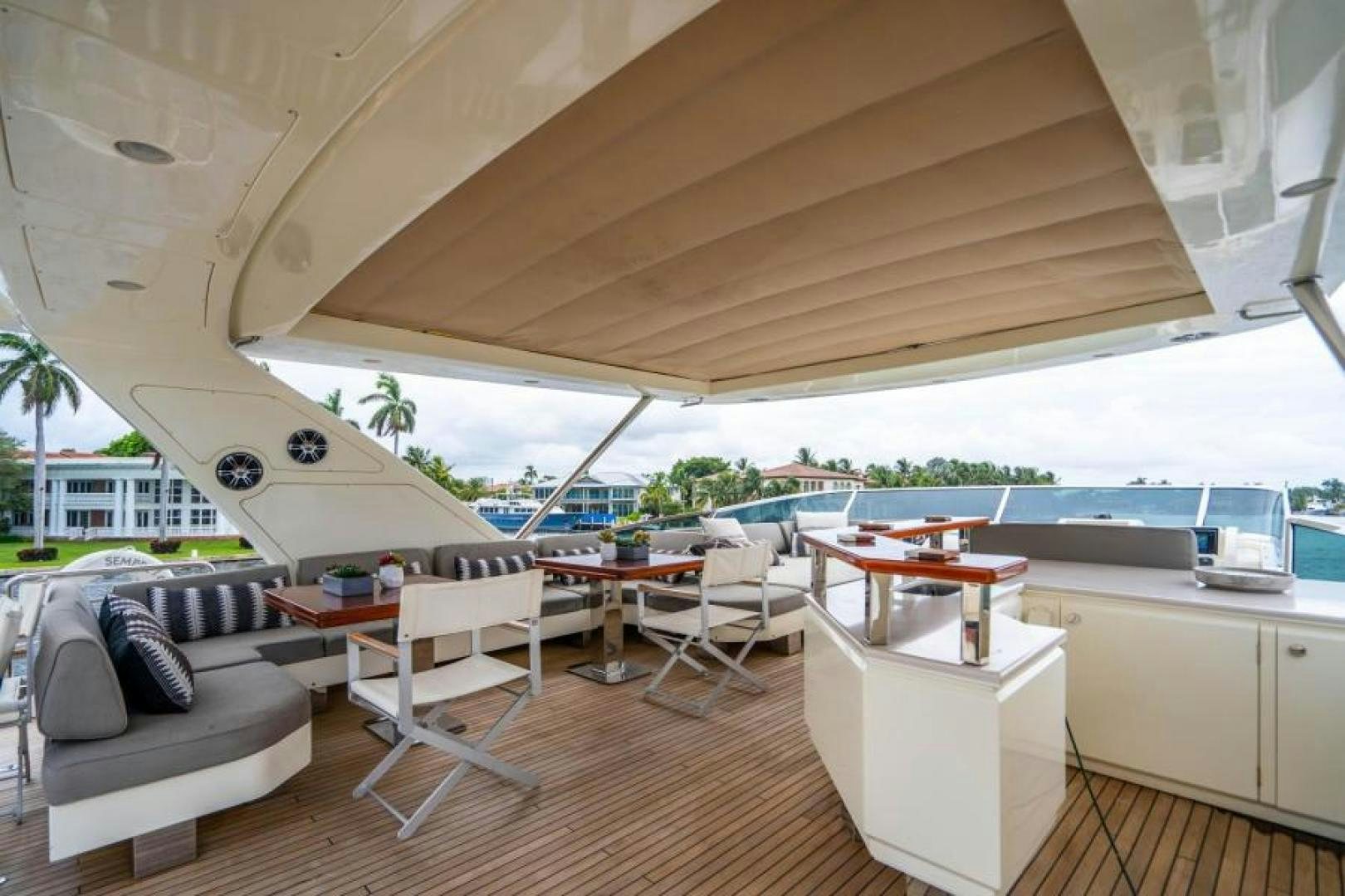 a room with a couch and a table and a large window aboard KNOT WOKE Yacht for Sale