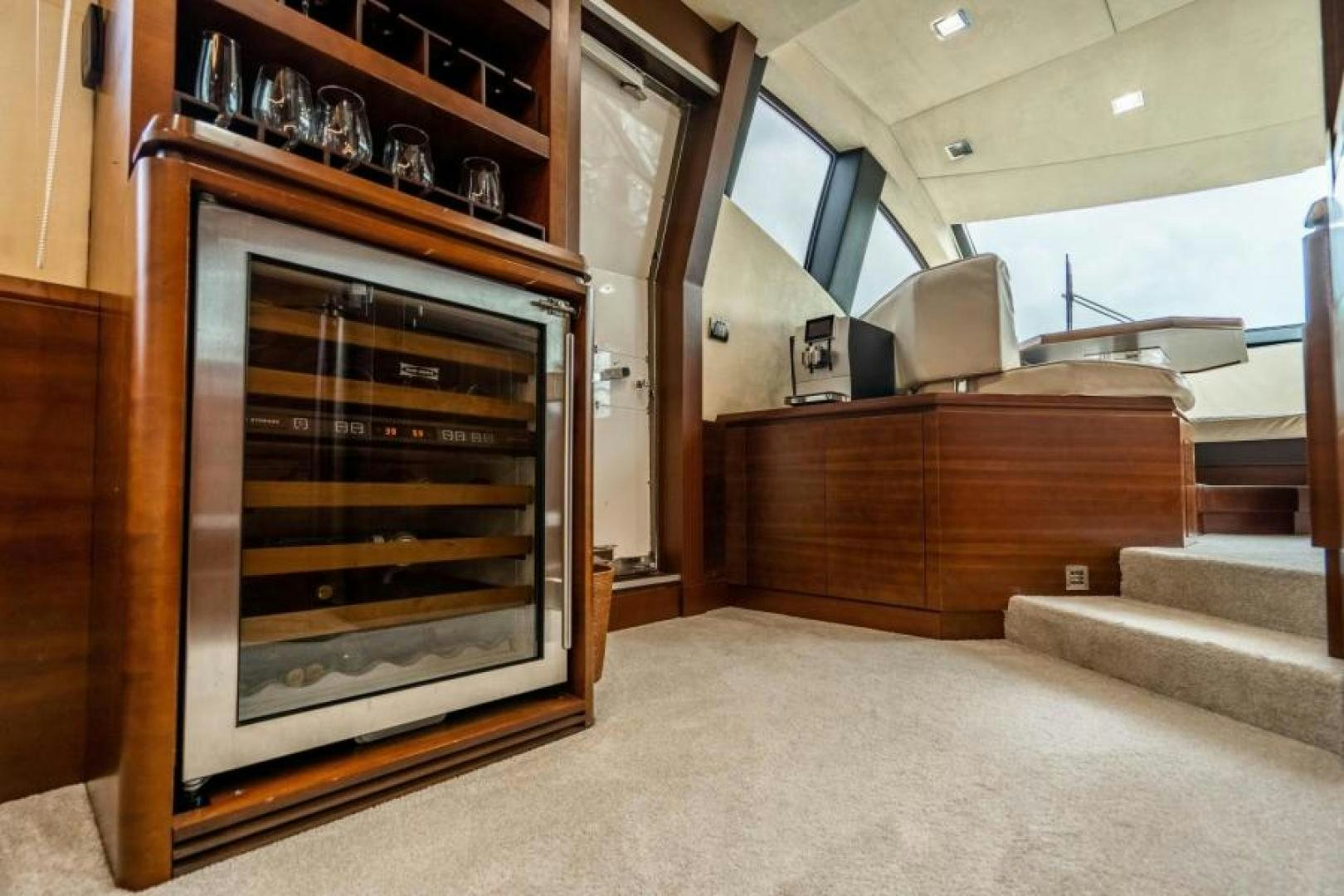 a living room with a fireplace aboard KNOT WOKE Yacht for Sale