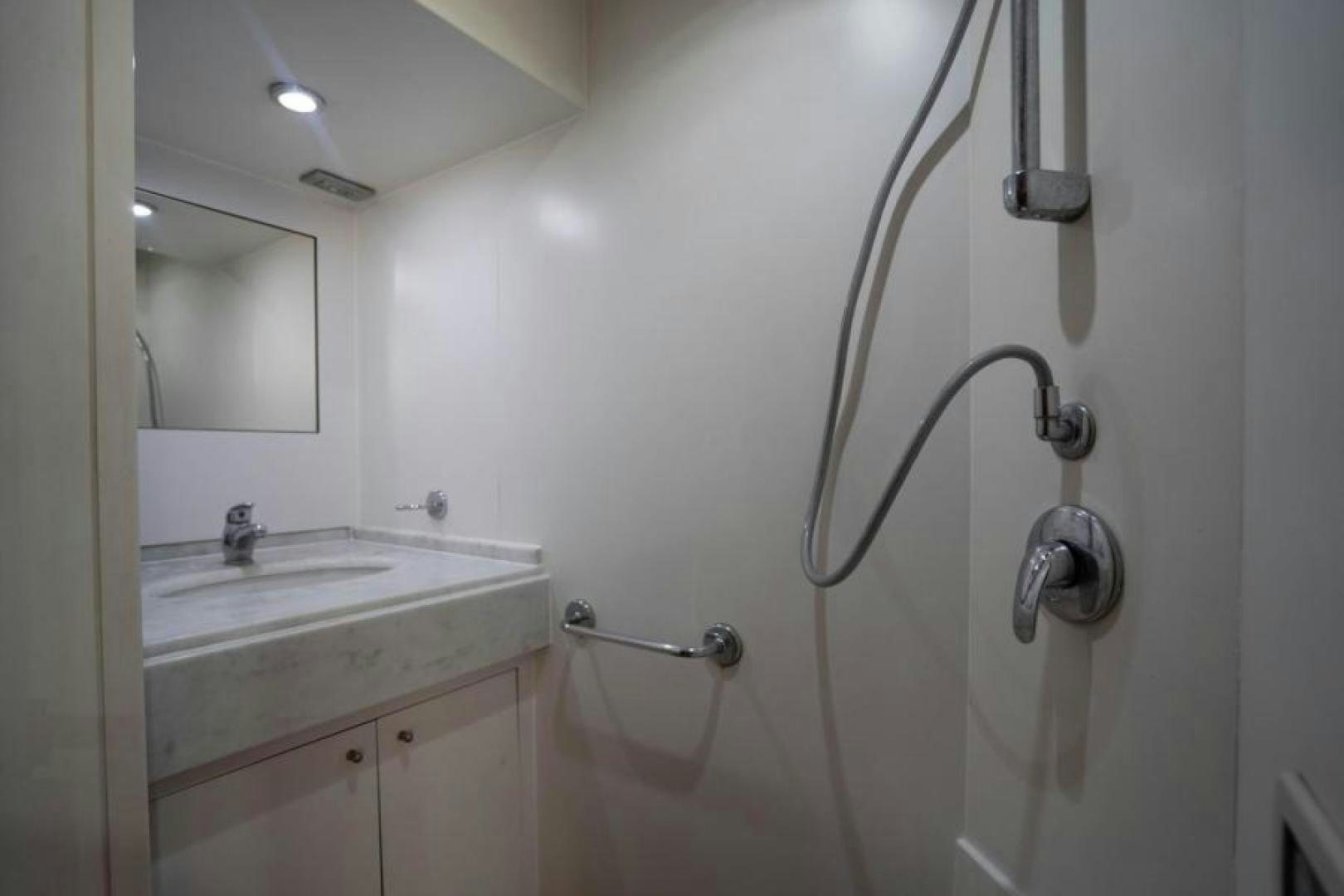 a bathroom with a sink and a shower aboard KNOT WOKE Yacht for Sale