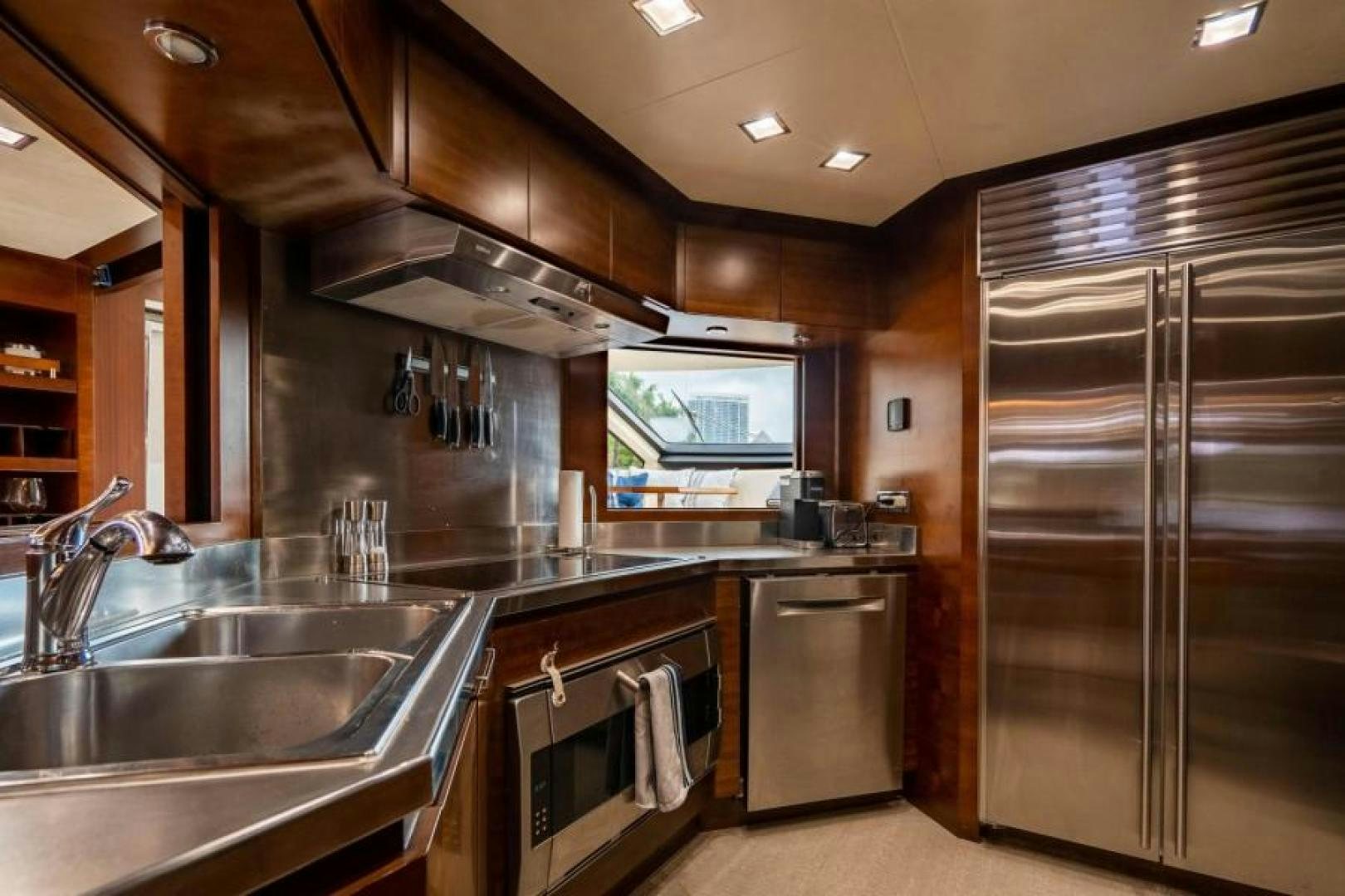 a kitchen with stainless steel appliances aboard KNOT WOKE Yacht for Sale