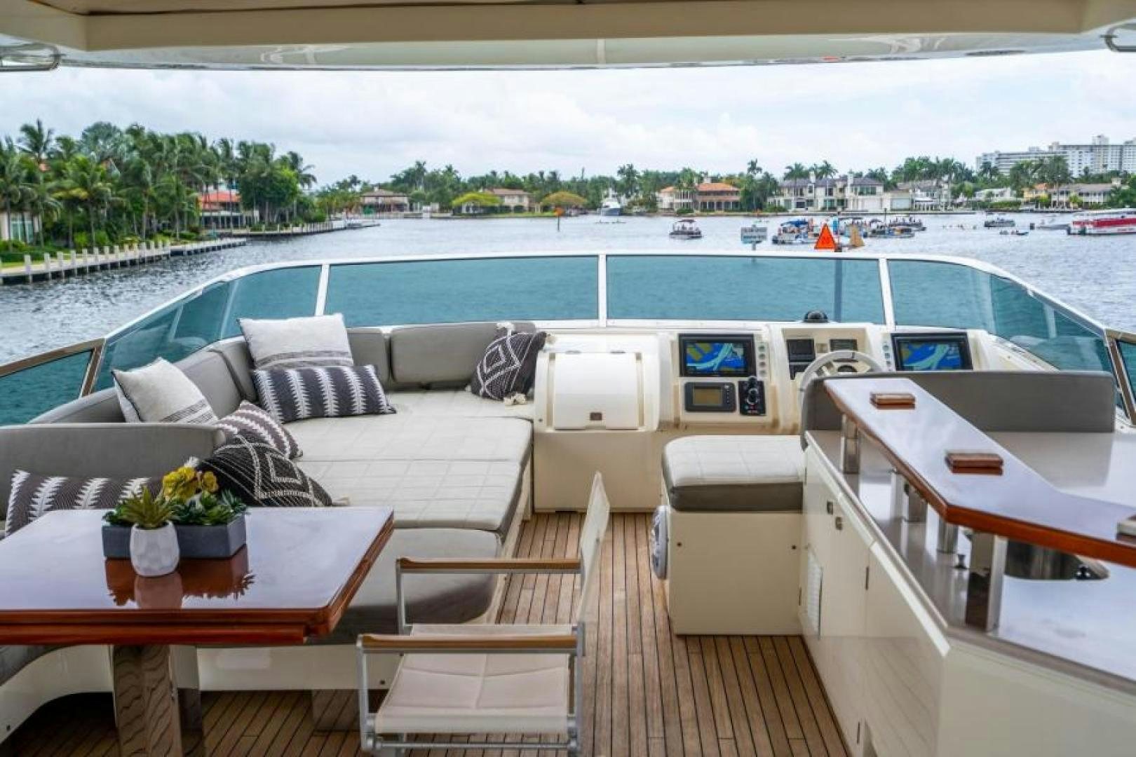 a deck with a couch and chairs aboard KNOT WOKE Yacht for Sale