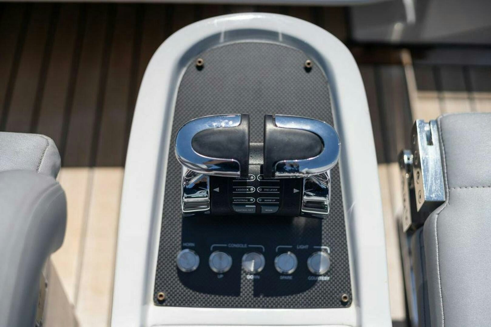 a black car with a steering wheel aboard VIDI Yacht for Sale