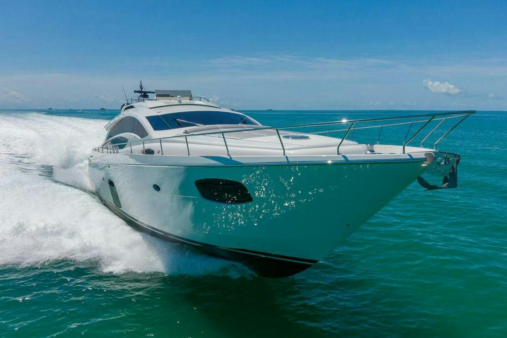 a white yacht on the water aboard VIDI Yacht for Sale