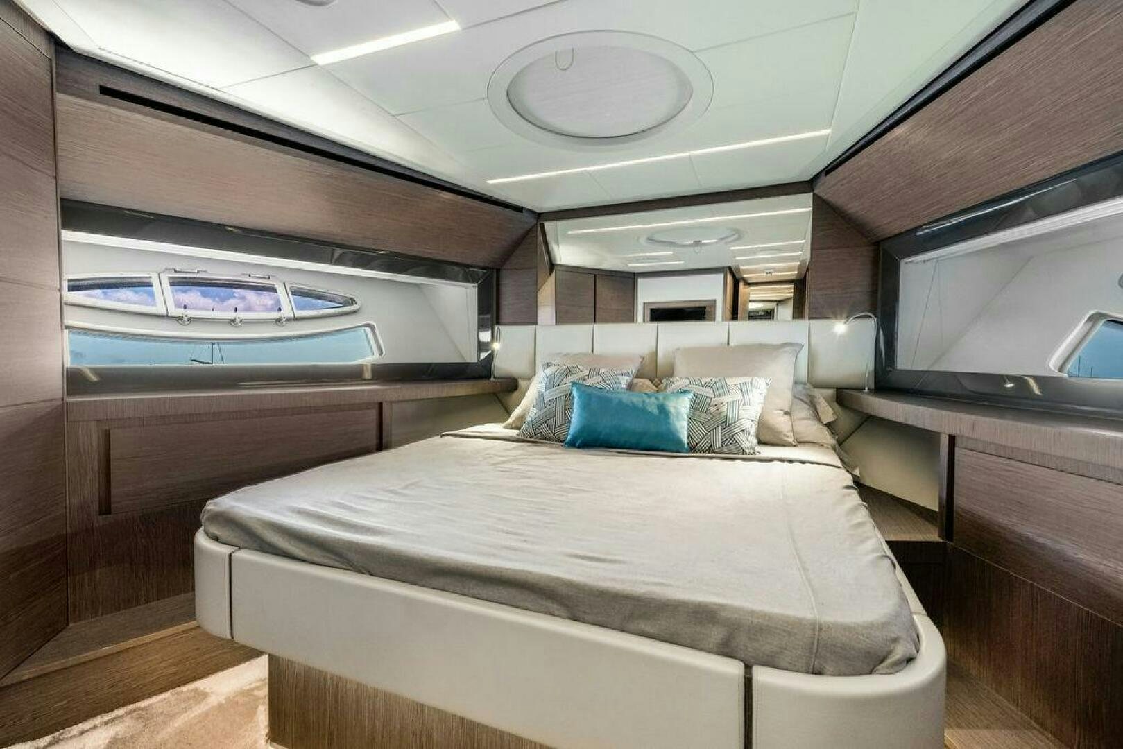 a room with a bed and a window aboard VIDI Yacht for Sale
