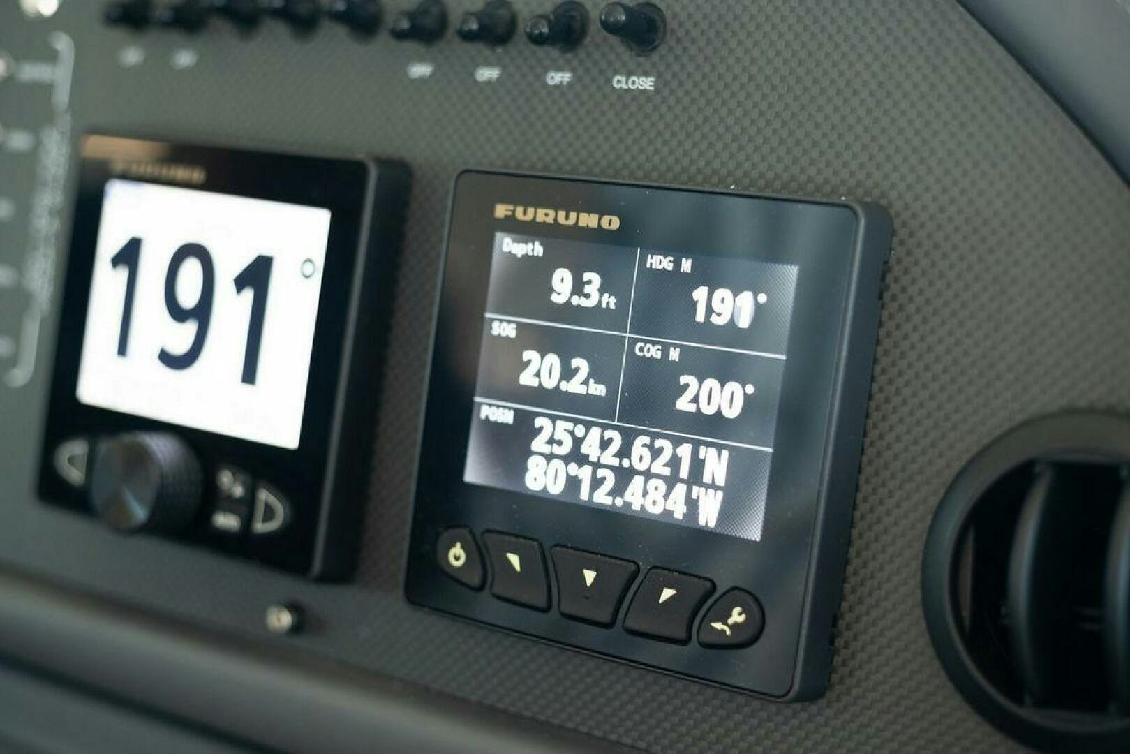 a close-up of a car dash aboard VIDI Yacht for Sale