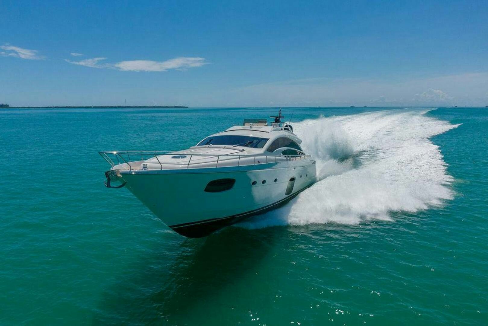 a white yacht splashing in the ocean aboard VIDI Yacht for Sale