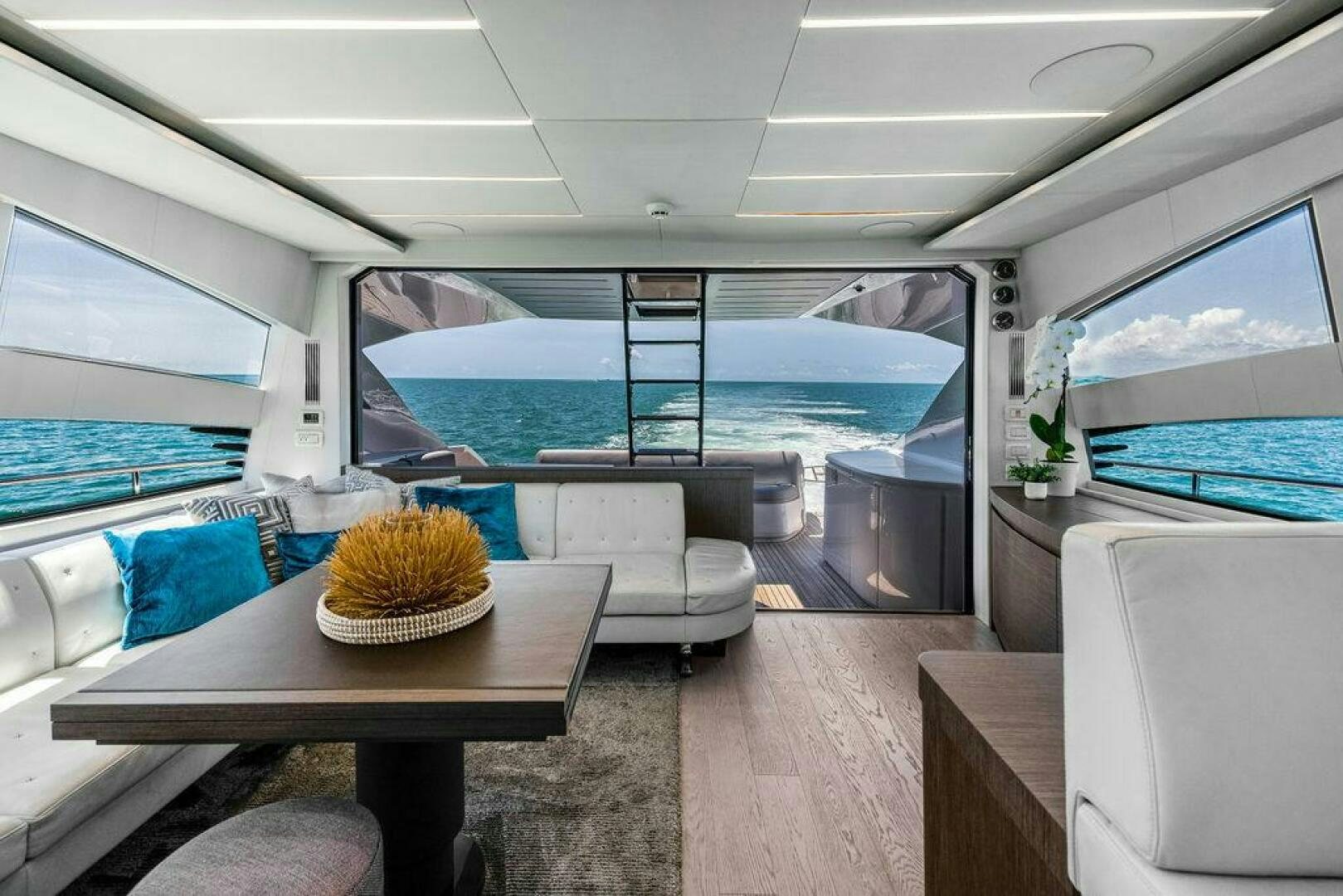 a room with a table and chairs aboard VIDI Yacht for Sale