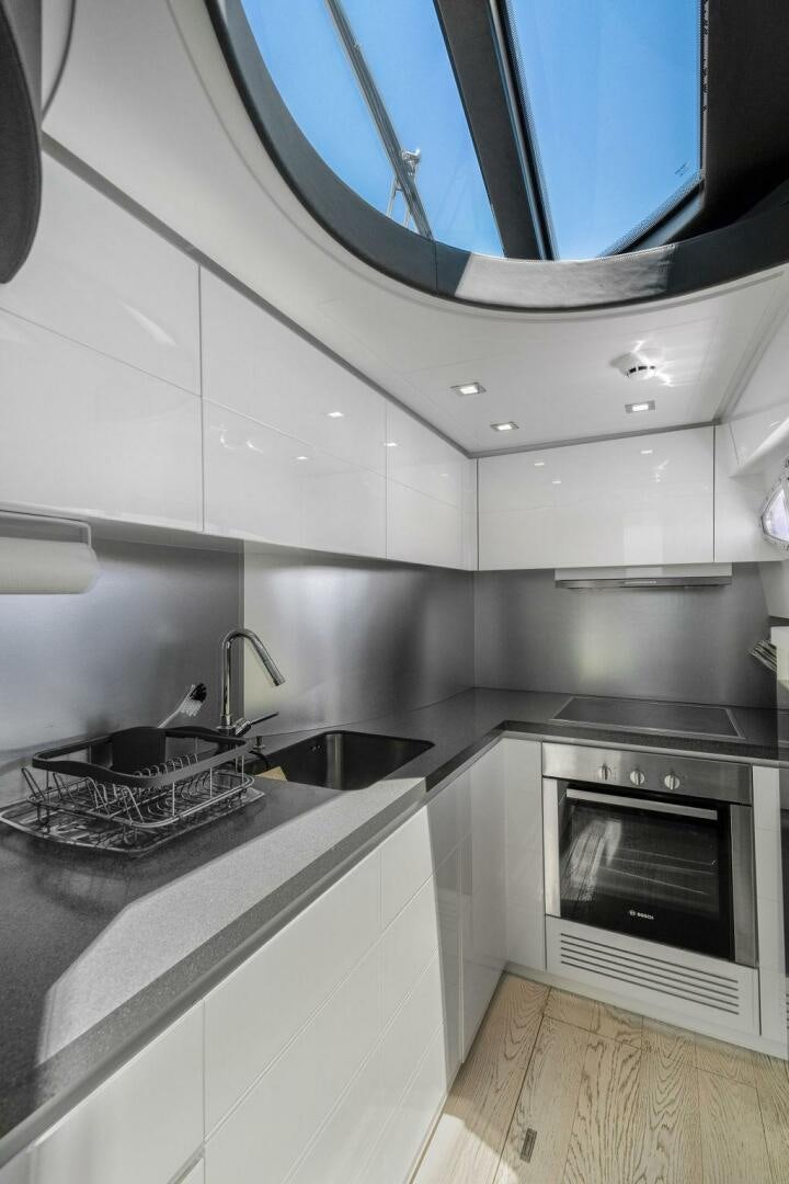 a kitchen with a sink and a stove aboard VIDI Yacht for Sale