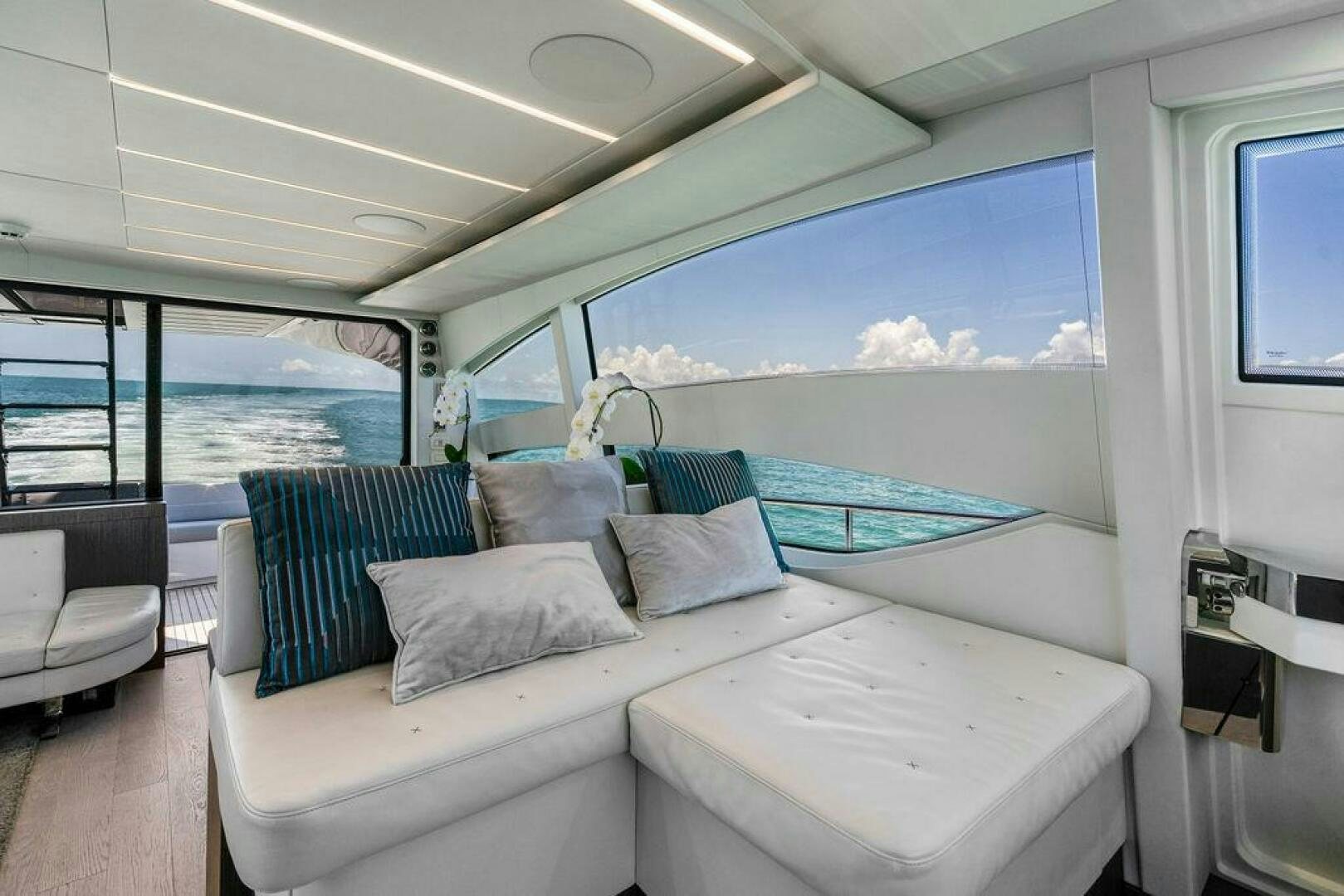 a room with a bed and a window aboard VIDI Yacht for Sale