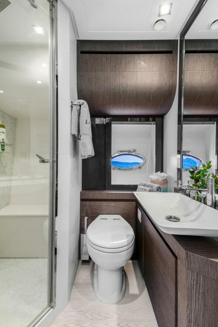 a bathroom with a toilet and a sink aboard VIDI Yacht for Sale