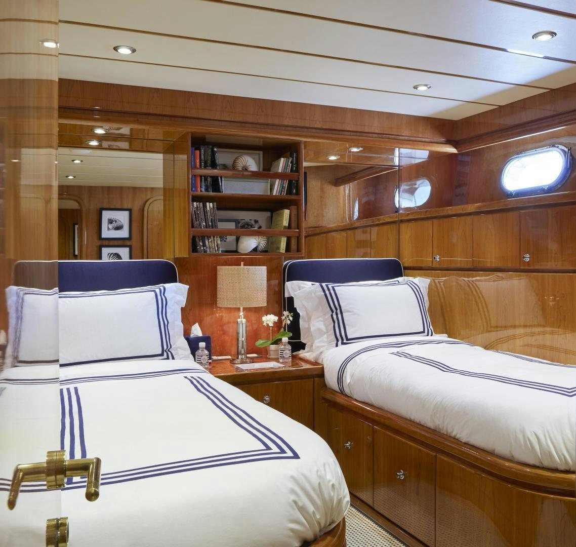 a room with two beds aboard GRACE Yacht for Sale