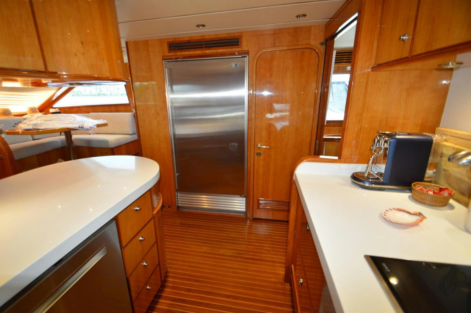 a kitchen with wooden cabinets aboard GRACE Yacht for Sale