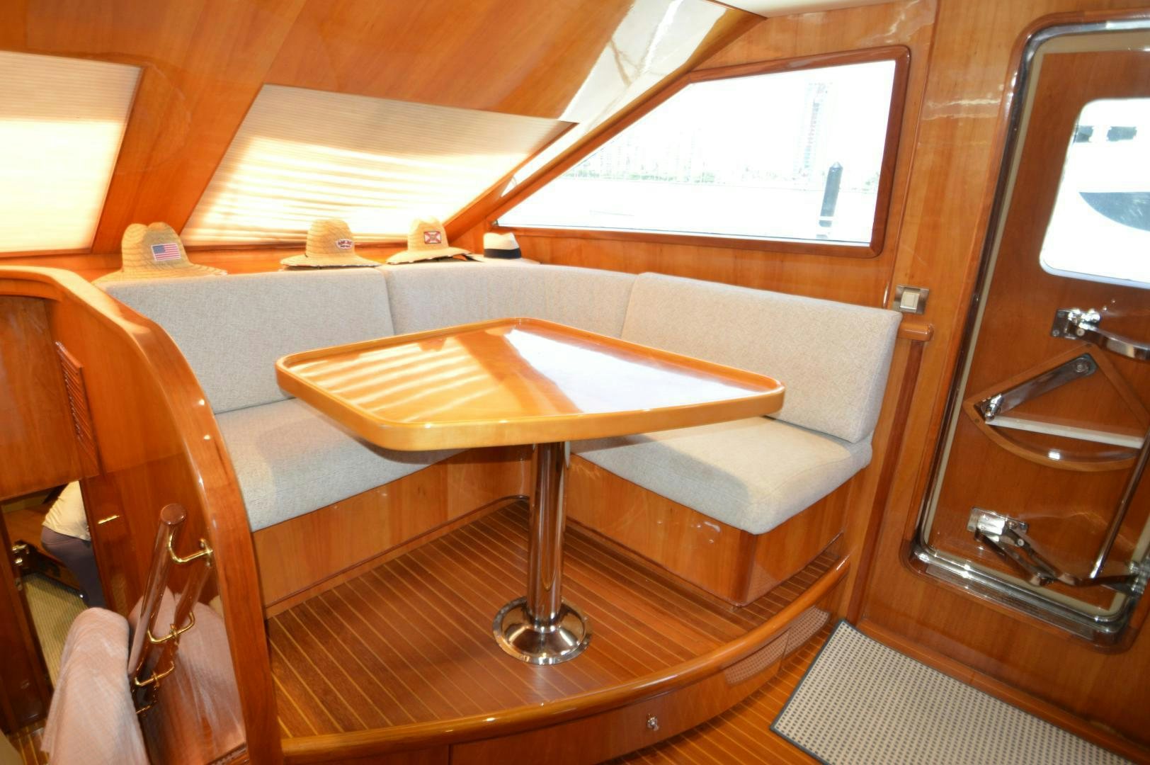 a room with a table and chairs aboard GRACE Yacht for Sale
