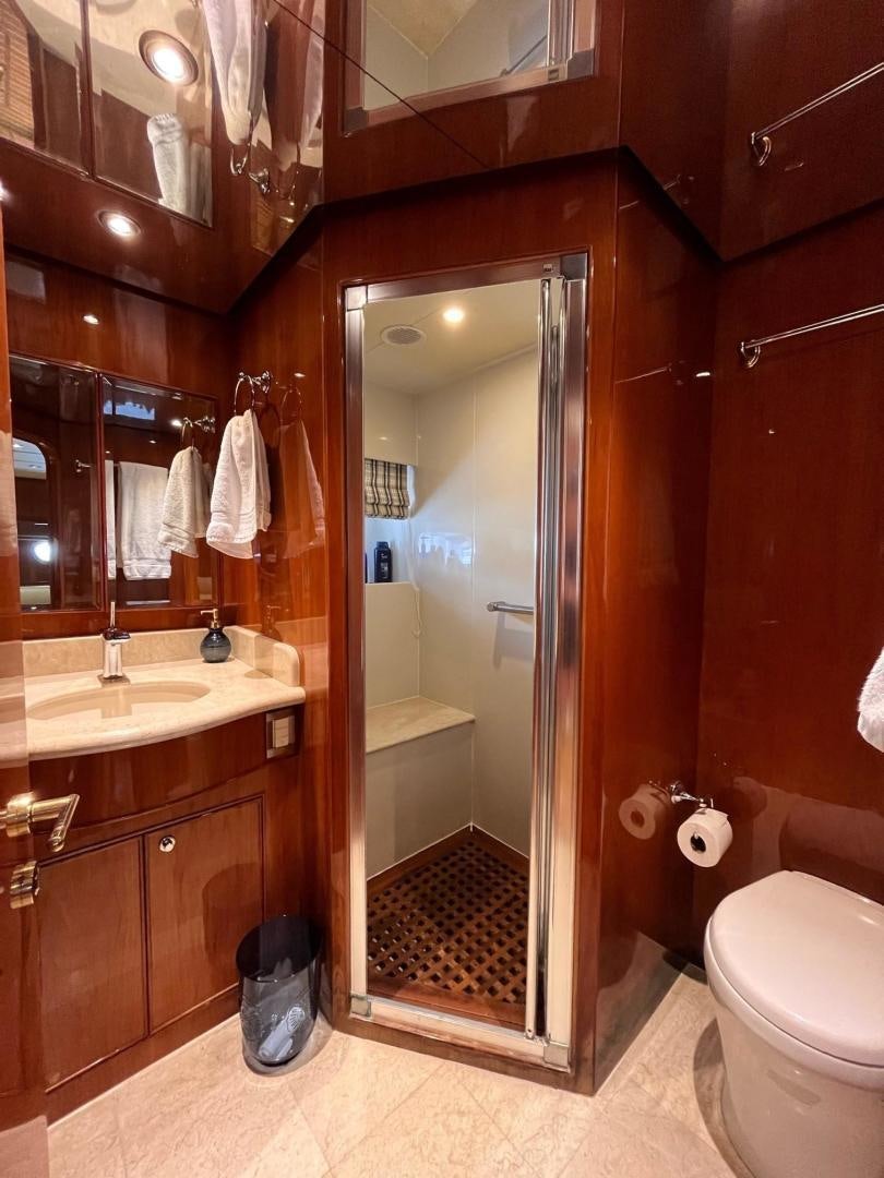 a bathroom with a glass shower aboard GRACE Yacht for Sale
