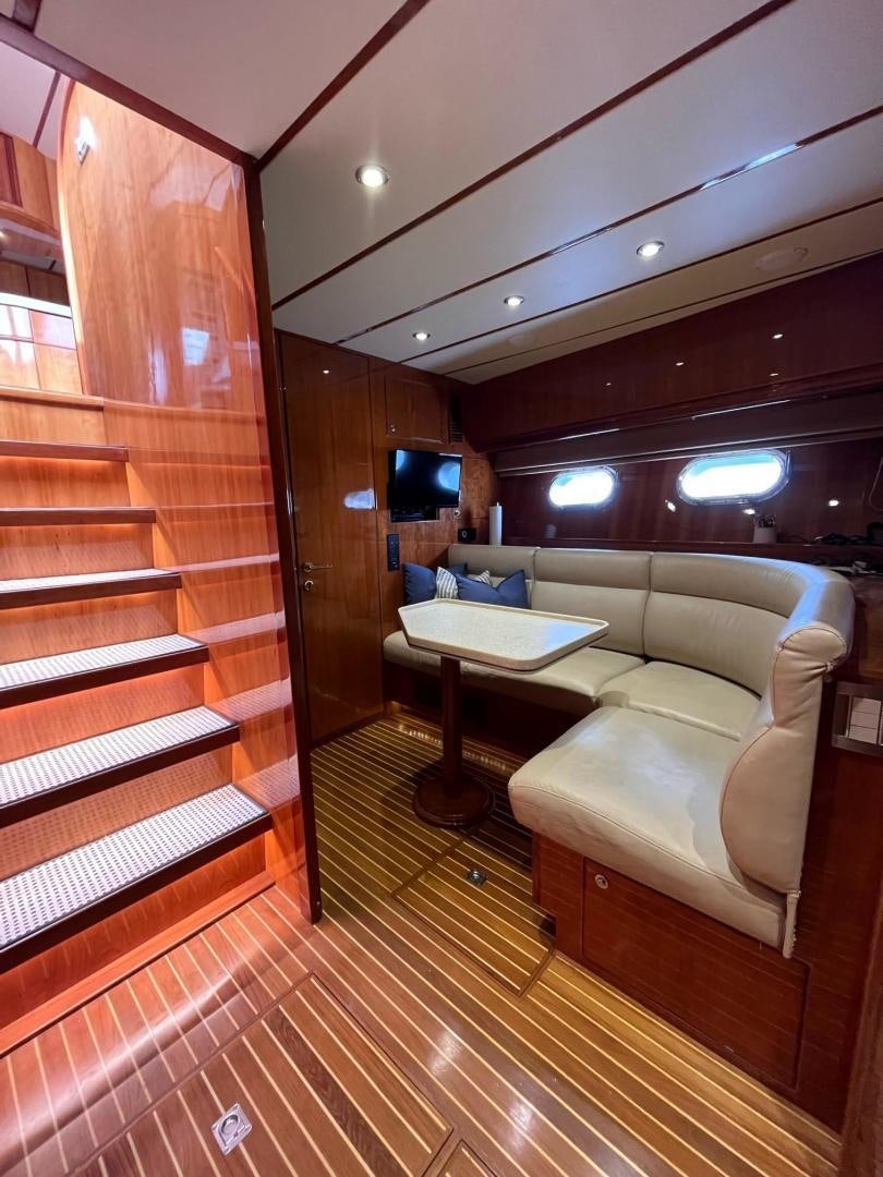 a room with a couch and a table aboard GRACE Yacht for Sale