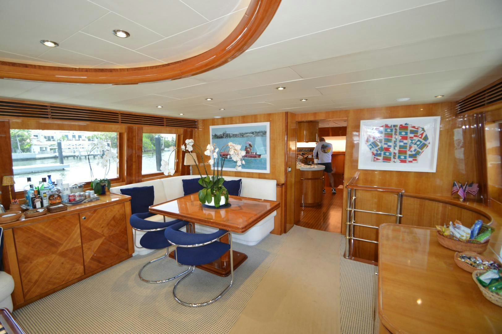 a room with a table chairs and a staircase aboard GRACE Yacht for Sale