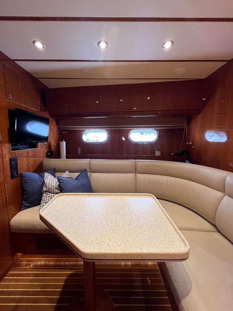 a couch and a television in a room aboard GRACE Yacht for Sale