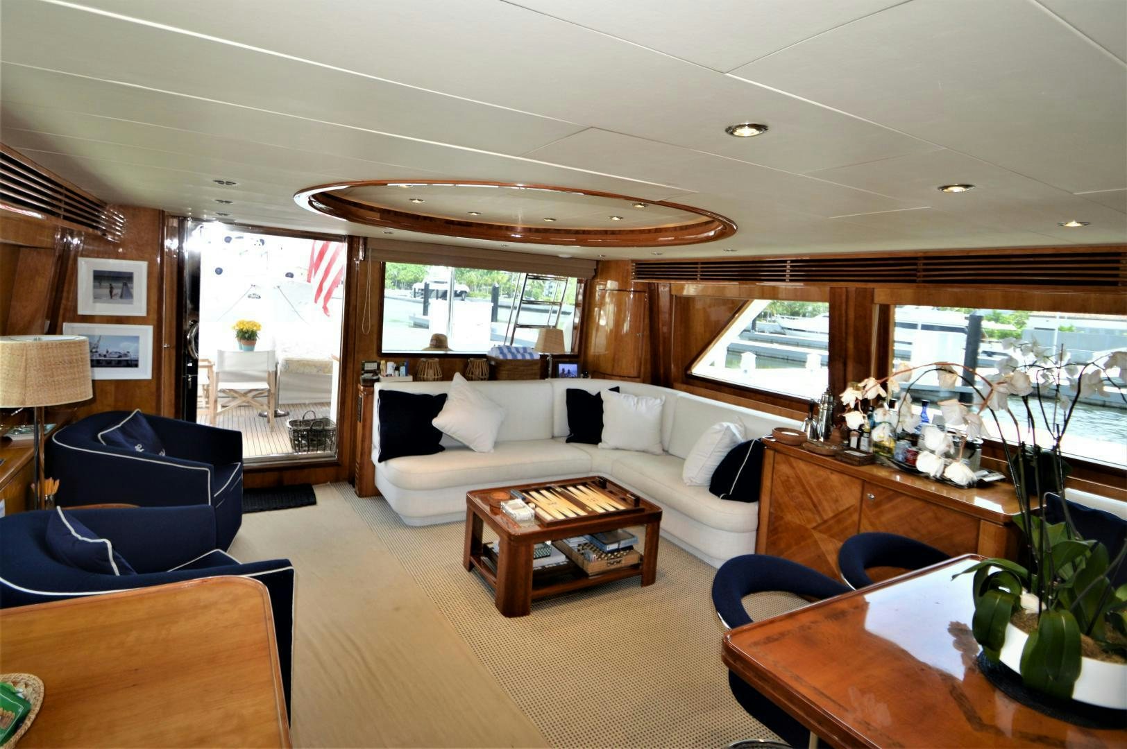 a living room with a couch and a table aboard GRACE Yacht for Sale